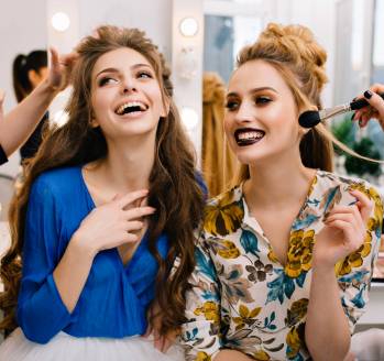 Preparation to great party of joyful young women in hairdresser salon. Expressing true positive emotions, stylish look, fashionable models, beautiful coiffure, makeup, beauty service, stylist